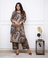 Black Cary print lacework kurti set with palazzos, made from cotton cambric. Indian ethnic outfit with intricate prints and delicate lace detailing for casual or semi-formal occasions