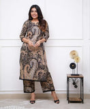 Black Cary print lacework kurti set with palazzos, made from cotton cambric. Indian ethnic outfit with intricate prints and delicate lace detailing for casual or semi-formal occasions