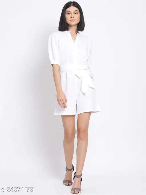 White women's polyester playsuit by Oxolloxo, features solid color, regular fit, mock collar, short puffed sleeves, and matching belt. Basic yet chic outfit