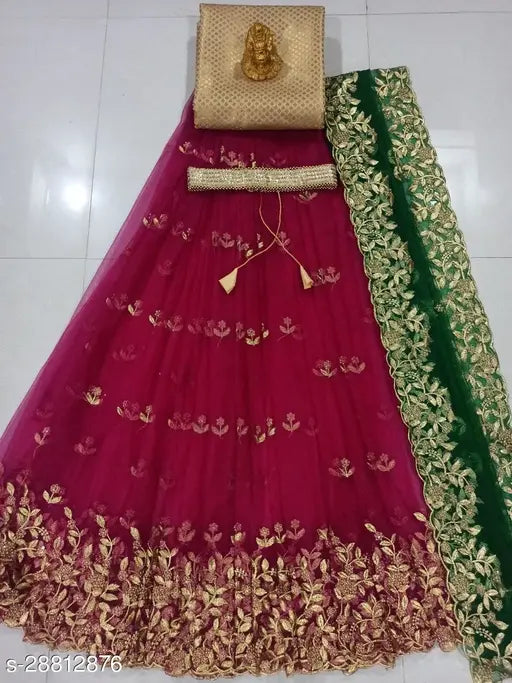 Unstitched traditional women's embroidered silk & net lehenga set with embellished belt, India