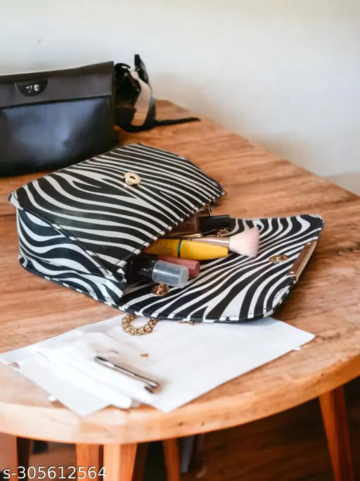 Synthetic animal print sling bag, 2 compartments, free size. Modern women's fashion accessory from India