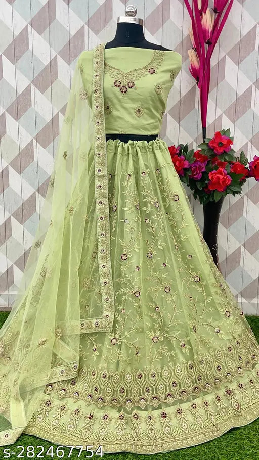 Pista color net lehenga-choli with embroidered top, bottom, and dupatta. Free size, best for regular occasions, originates from India
