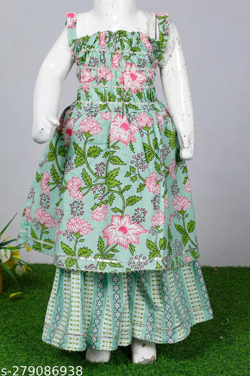 Green cotton kurti sharara set for baby girls, Spack Jerrow printed anarkali with elastic and half sleeves, vibrant Gota Patti and Dori design. Elegant ethnic Indian dress for festivals like Diwali, Janmashtami, Rakhi. Made from Cambric cotton