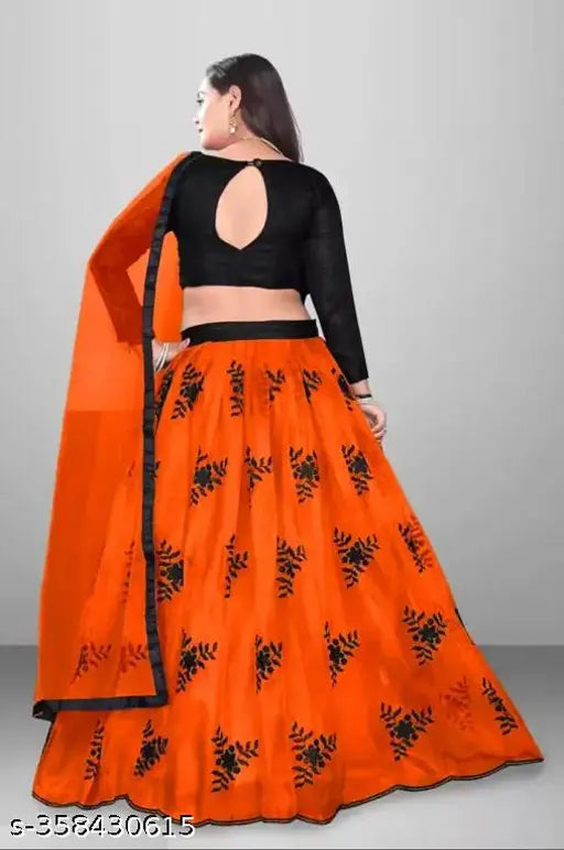 Trendy satin lehenga with net bottomwear and botanical dupatta, semi-stitched Indian outfit on mannequin