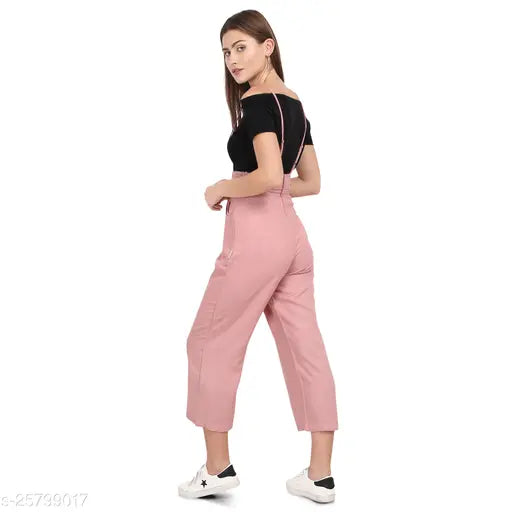 Pretty fabulous women's rayon jumpsuit, solid pattern, short sleeves, available in sizes S, M, L. Includes white polyester crop top