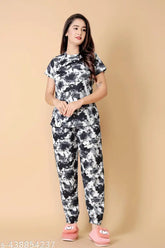 Printed cotton nightdress set and pyjama coord set for women and girls, featuring short sleeves and round neck design for top, ankle-length bottom with side pockets, easy movement fold, and adjustable elasticated band. Indian origin