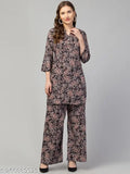 Black multi printed rayon top with palazzo set for women, featuring three-quarter sleeves and a printed design reminiscent of a woman's dress. Suitable for various occasions, machine washable, and available in multiple sizes (M, L, XL) and colors. Indian craftsmanship