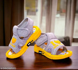 Waterproof durable yellow canvas and rubber walking whistle sandals for little kids, featuring a cute printed net design. Perfect for infants and toddlers' night outings, with a comfortable and supportive sole