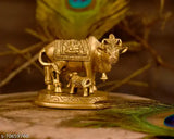 Handmade brass Kamdhenu Nandi cow statue with golden finish, Indian artisanal animal showpiece for home decor or gifts