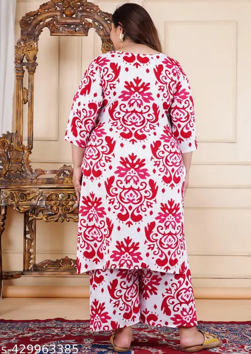 Plus-size floral printed rayon kurta and palazzo set, featuring three-quarter sleeves and vibrant blooms