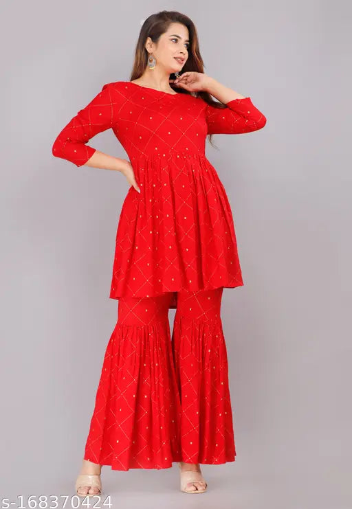 Red printed Rayon kurta and sharara set, SAPONHARSH women's fashionable 3/4 sleeves and boat neck with gold embellishments, made in India