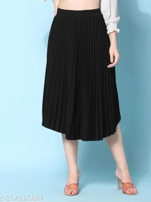 Black crepe pleated midi skirt, full-length, elastic waistband, flared hemline. Trendy, versatile, and comfortable for all body types. Perfect length for the average Indian woman. Made from wrinkle-free crepe fabric. Size XS (32W, 28L, 40H), India origin