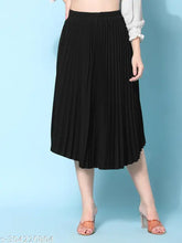 Black crepe pleated midi skirt, full-length, elastic waistband, flared hemline. Trendy, versatile, and comfortable for all body types. Perfect length for the average Indian woman. Made from wrinkle-free crepe fabric. Size XS (32W, 28L, 40H), India origin