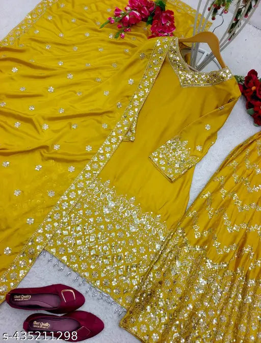 Designer embroidered silk sharara with embellished net, heavy satin sleeves & elastic rubber sarara, micro cotton inner, full-stitched dupatta. Indian handcrafted traditional ethnic wear on display