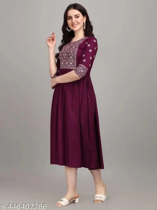 Purple embroidered viscose rayon A-line kurta with three-quarter sleeves, Indian women's traditional outfit on hanger