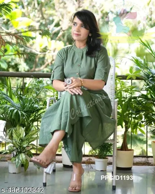 Green cotton A-line kurta set with striped design, three-quarter sleeves, calf length, paired with coordinating green palazzos - ideal for daily wear and casual outings