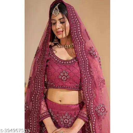 Embroidered net lehenga set, designer Indian bridal wear on mannequin