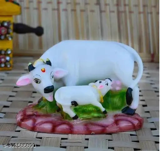 White and green Polyresin Cow N Calf Idol Kamdhenu Statue with Mount Nandi God, perfect for Feng Shui showpieces and spiritual lucky gifts. Dimensions: L12cm x W7cm x H10cm (5in x 3in x 4in)