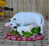 White and green Polyresin Cow N Calf Idol Kamdhenu Statue with Mount Nandi God, perfect for Feng Shui showpieces and spiritual lucky gifts. Dimensions: L12cm x W7cm x H10cm (5in x 3in x 4in)