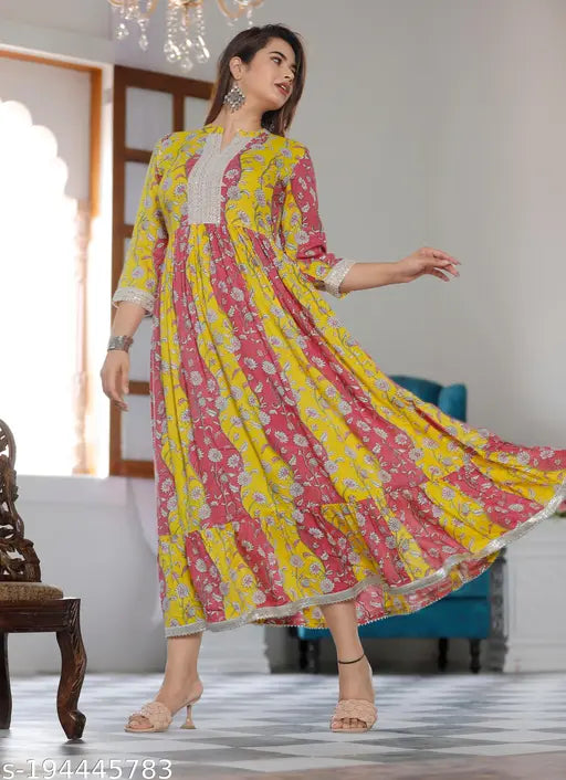 Yellow rayon printed kurti gown, three-quarter sleeves. Rayon women's party wear from India