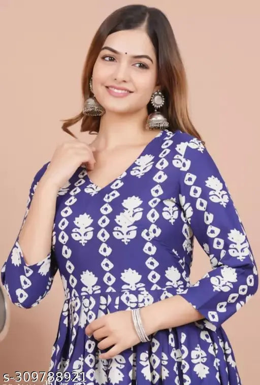 Blue floral print rayon Anarkali kurti, comfortable and stylish for women's ethnic wear. Rayon fabric, three-quarter sleeves, perfect for festive or everyday occasions. #AnarkaliKurti #RayonKurta