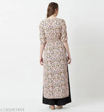 Multicolor peach floral maxi top with round neck, 3/4 sleeves, tassel detailing & front slit. Indian-made women's fashion