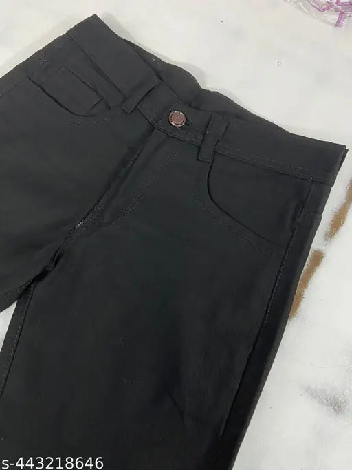 Denim, plain black, high-rise men's jeans with clean distress. Full-length, regular fit for smart and fashionable look." (102 characters)