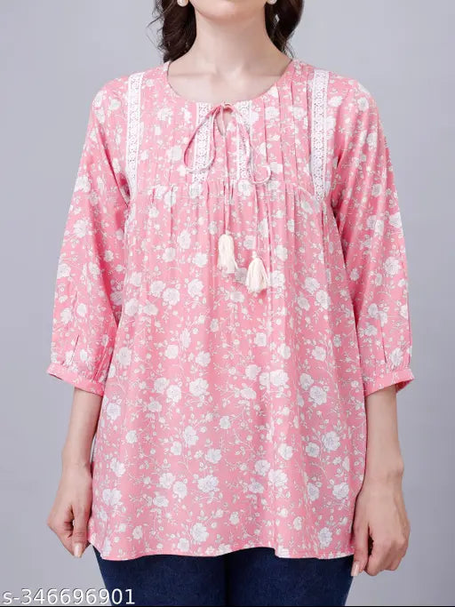 Cotton viscose pink floral tunic top, lace detail, V-neckline with tie-up, ideal for casual yet stylish occasions