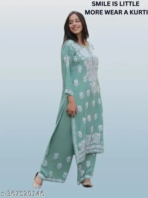 Rayon Chikankari suit set: Embroidered net three-quarter sleeve kurta with palazzos, Indian women's fashion" (124 characters)