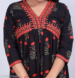 Black women's floral print cotton rayon anarkali kurta, trendy and elegant fashion statement on a mannequin