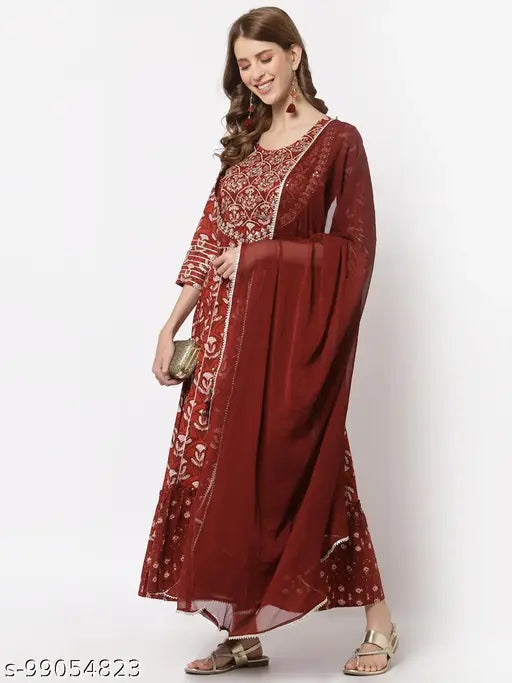 Yellow Cloud women's printed and embroidered flared cotton gown with chiffon dupatta (Rust), hand-dori work, gota details, and 3/4 sleeves. Indian ethnic wear in rust tones, perfect for everyday style