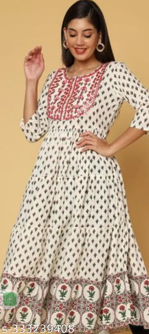 Cream rayon analkali blouse with embroidered pattern, three-quarter sleeves, available in sizes M-4XL. Indian ethnic women's fashion piece on display