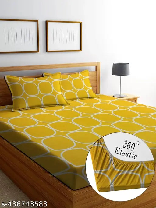 Yellow glace cotton fitted double bedsheet set with two matching pillow covers, providing ultimate comfort and durability for a cozy, vibrant bedroom update