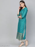 Green rayon kurta with gold print and white plazo bottomwear, traditional Indian festival wear