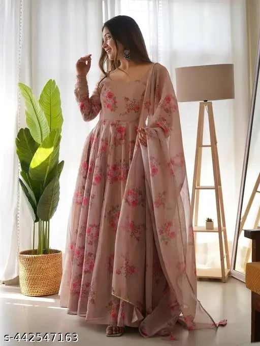 Elegant cream Krishna Chiku Georgette gown with floral print, long sleeves, and matching dupatta, featuring golden piping border. Perfect for festive events or special occasions. Made in India