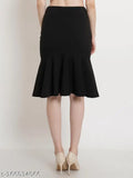 Black polyester peplum skirt, knee-length and midi styles, great for balancing out wider shoulders and flattering figure. Knitted and comfy, perfect choice for women. Made in India (Size: 26, 28, 30, 32)