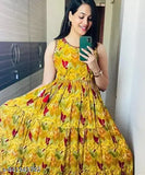 Yellow cotton sleeveless gown for women and girls, vibrant printed combo, perfect for events on a mannequin