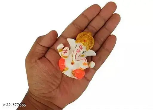 Orange poly resin Ganesh idol for car dashboard, popular Hindu deity figure on Indian dashboards