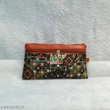 Stylish floral fabric combo sling bag, lightweight and colorful, features 5 compartments and a detachable chain handle. Multicolor design perfect for matching accessories. Handcrafted in India