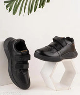 Synthetic black Tway school shoes for kids, slip-on design ideal for boys and girls aged 6-12, made in India