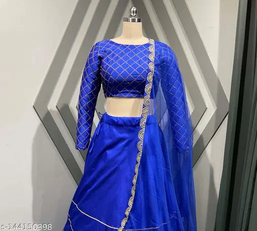 Fancy satin lehenga choli with embroidered top, satin bottom, and net dupatta. Indian designer bridal wear, umbrella flair, lined, and semi-stitched (Lehenga waist: 38 in, Lehenga length: 41 in, Dupatta length: 2.2 m). Lace detailing on all sides for an elegant look. Best quality fabric available