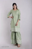 Rayon one-stitched kurta and sharara set, printed net three-quarter sleeves Indian outfit on mannequin