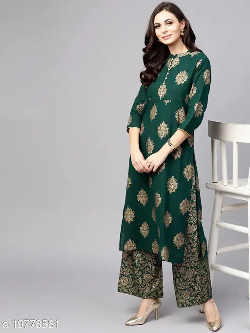 Green Rayon Kurta Set with Palazzos, printed net design, three-quarter sleeves. Single size L (Bust 40in, Shoulder 14in, Waist 38in, Hip 44in, Length 46in, Bottom Waist 38in, Bottom Hip 44in, Bottom Length 39in), made in India