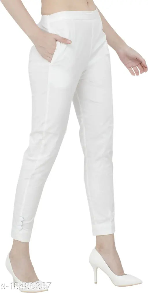 White lumlum cotton-lycra slim fit trousers for women, ideal for city fashion. Soft and comfortable, suitable for various tops or kurta styles. Available sizes: 26-38 inches waist, 24.5-37 inches length