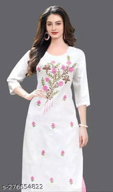 Trendy pink cotton kurti, three-quarter sleeves, embroidered pattern. Ethnic wear for festivals or everyday occasions. Traditional Indian fashion