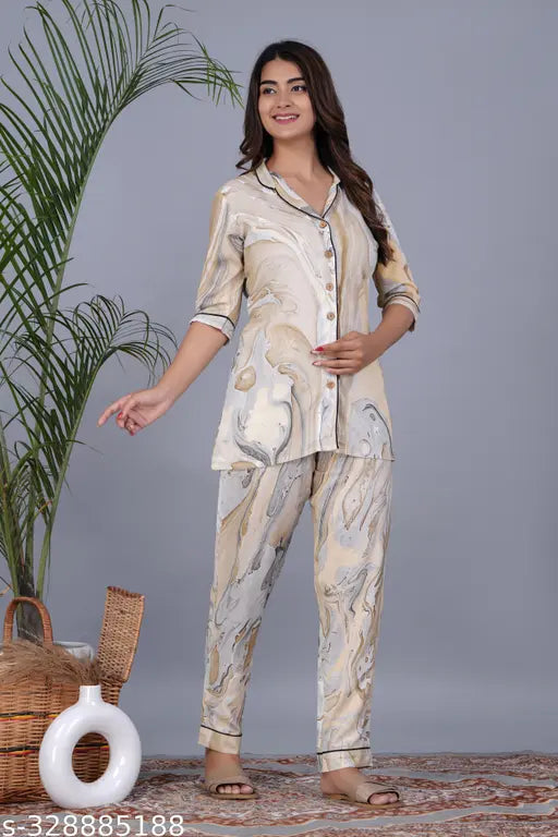 Pure rayon printed night suit for women, featuring an A-line design with shirt top and pyjama bottoms. Indian-origin nightwear in various sizes M, L, XL, XXL from AAVRITTI QUEENS