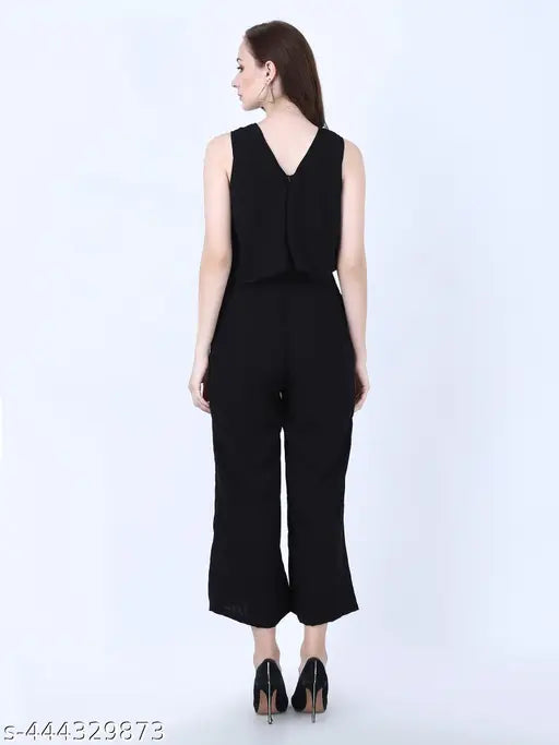 Black cotton blend sleeveless jumpsuit for women & girls, full-length with V-neck and side pockets. Stylish and casual, perfect for homewear, school, shopping, beach, vacation, or any activities. Made in India