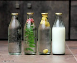 Clear glass fancy water bottles (pack of 12), airtight leak-proof gold cap, ideal for milk, water, shakes. Indian origin