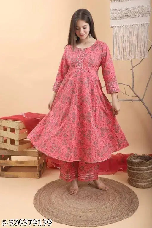 Pink gold rayon kurta with rayon bottomwear, three-quarter sleeves, printed net pattern on display stand