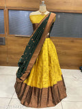 South Indian style traditional half saree set in art silk, unstitched with zari patterns and a matching belt. Handcrafted Indian fashion accessory." (124 characters)